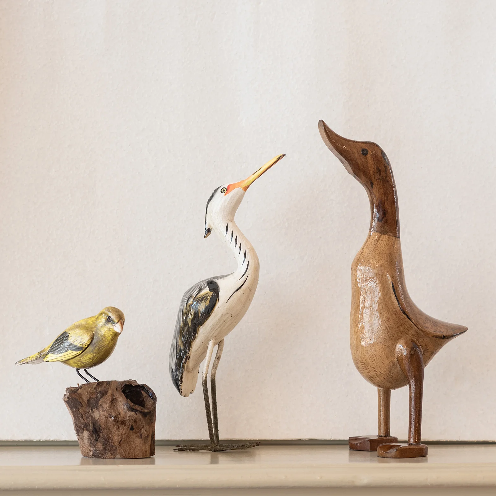 different birds heron duck goldfinch wooden