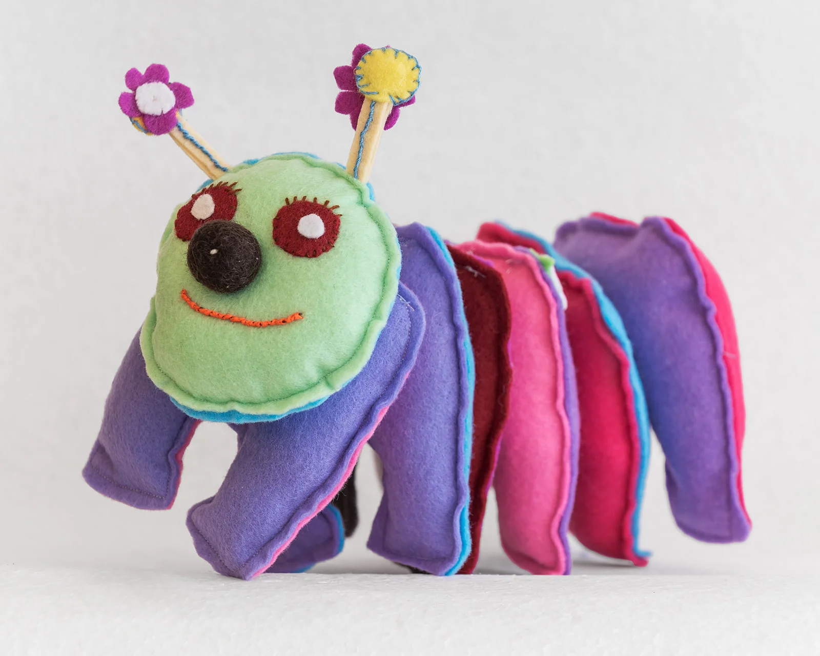 felt toy caterpillar sections purple