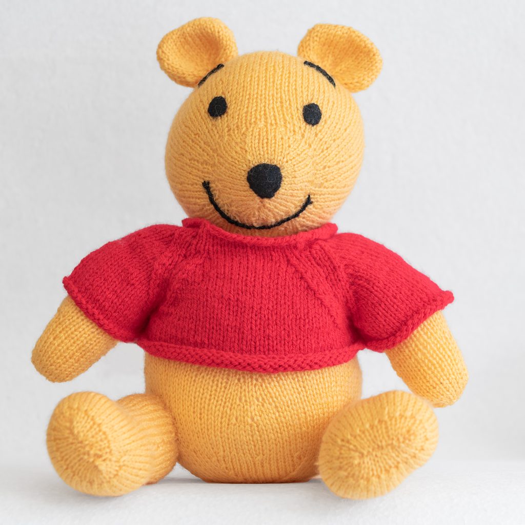pooh bear yellow knitted teddy with red jumper