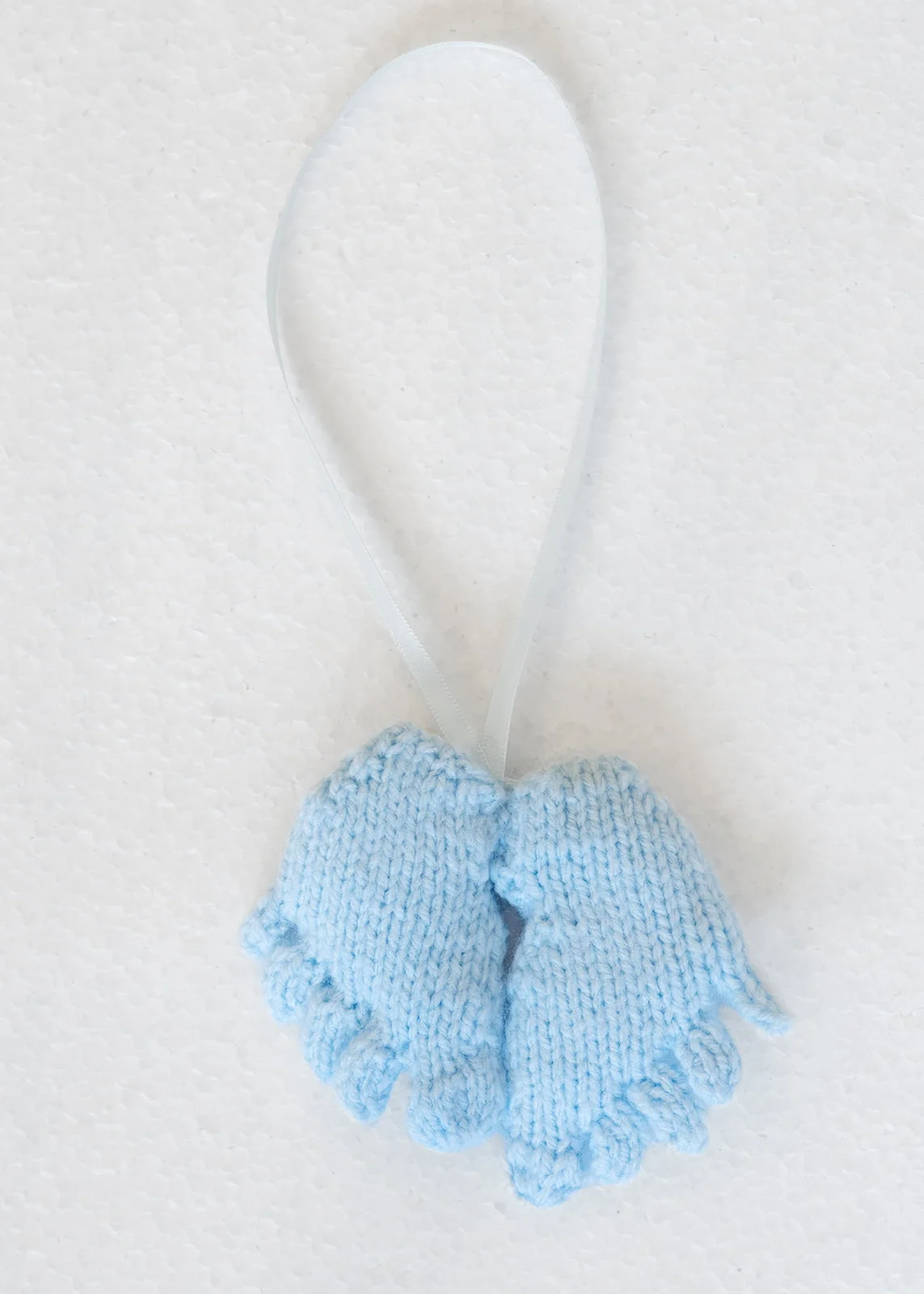 knitted blue toy feet