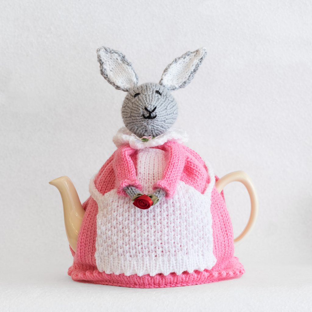 hand knitted pink rabbit tea cosy