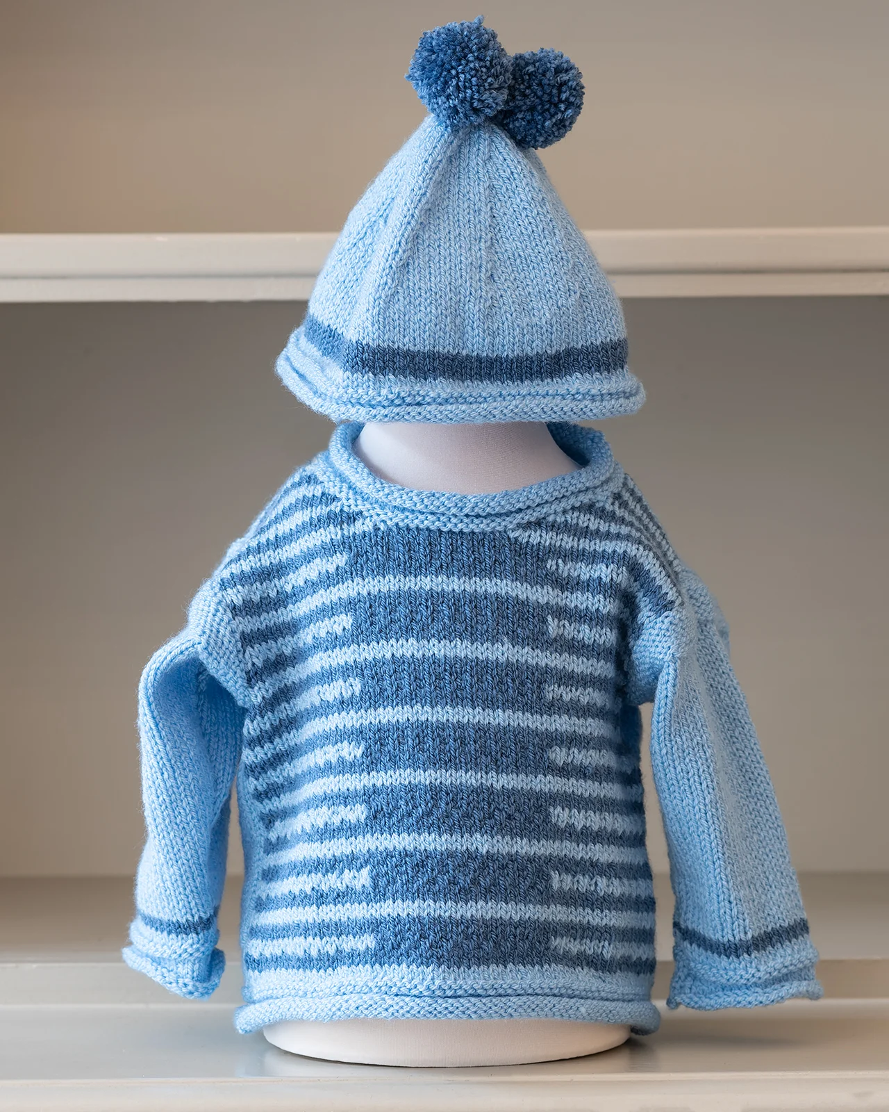 hand knitted blue kids jumpers with hat