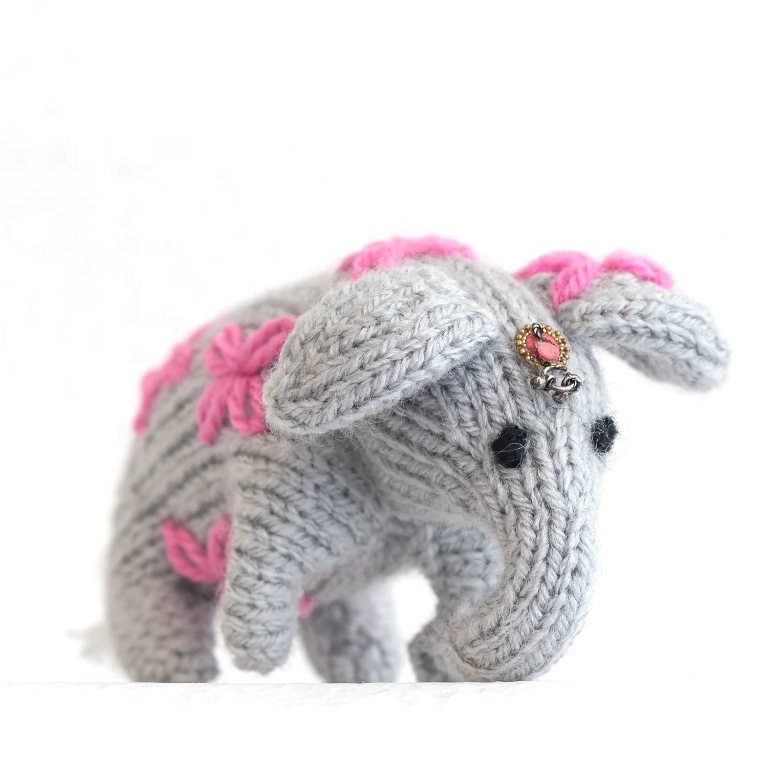 hand knitted grey and pink elephant